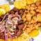 Picadera De Carne Acompanado Con Tostones, Chicharron De Pollo Con Hueso, Masita Frita