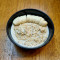 Peanut Butter Banana Porridge Served With Chia Seeds And Honey